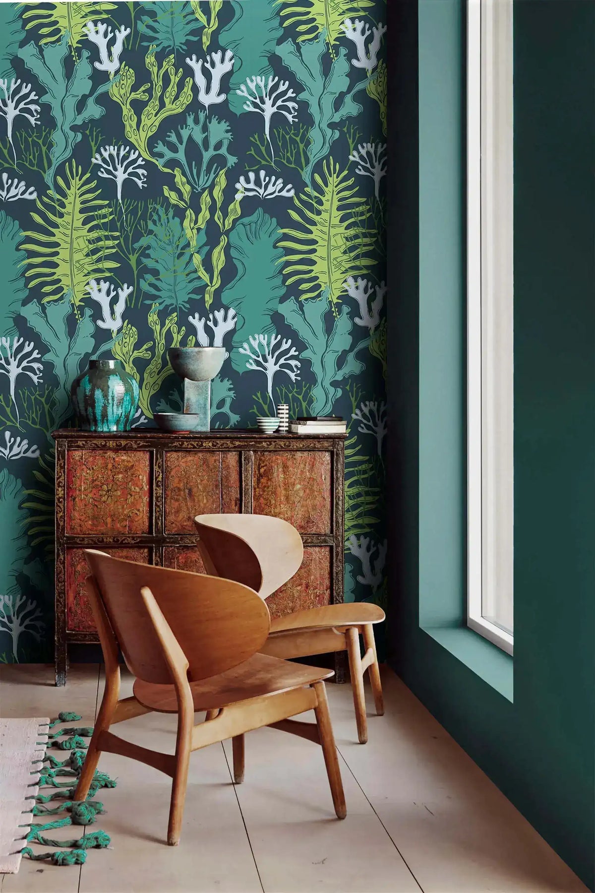 Underwater Flora Wallpaper of vivid green kelp and coral above an ornate red cabinet