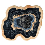 A uniquely shaped, hand-tufted wool area rug with an abstract concentric pattern, perfect for adding a contemporary touch to your living room. The design features layers of black, beige, and blue, creating a stunning focal point suitable for an 8x10 living space.