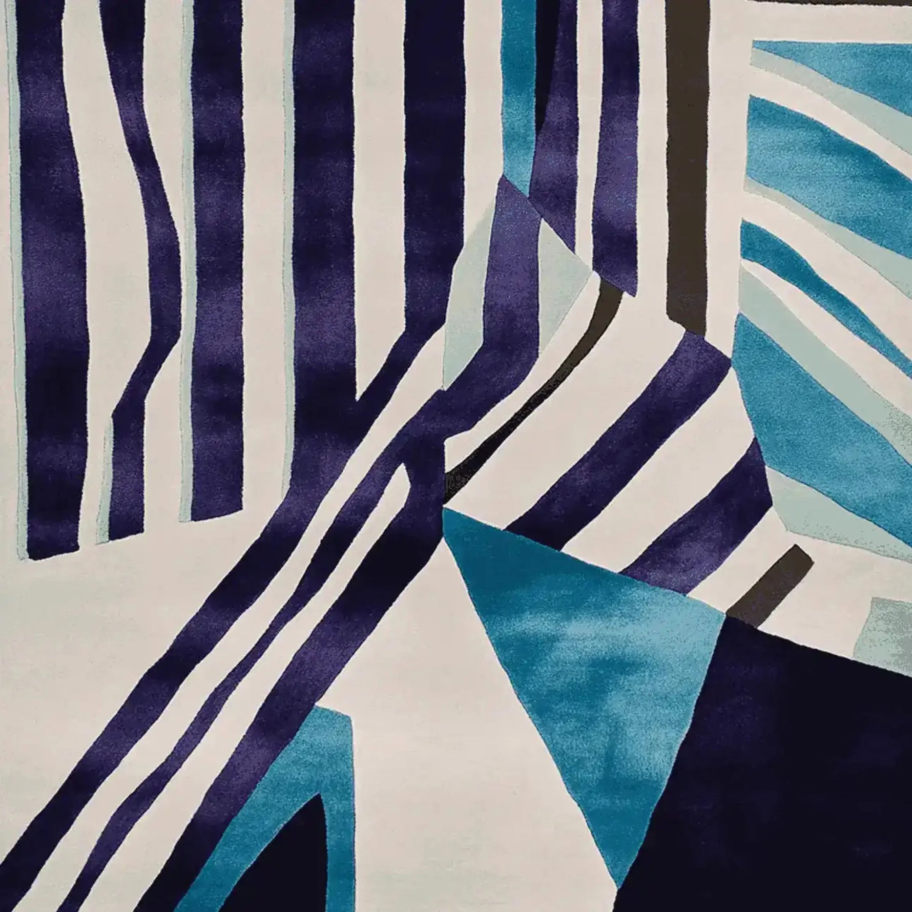 A vibrant area rug with bold stripes in shades of blue, white, and black, perfect for adding a contemporary touch to any living room. This wool rug features an abstract design that makes it an ideal choice for modern home decor, offering both style and comfort as a living room area rug.