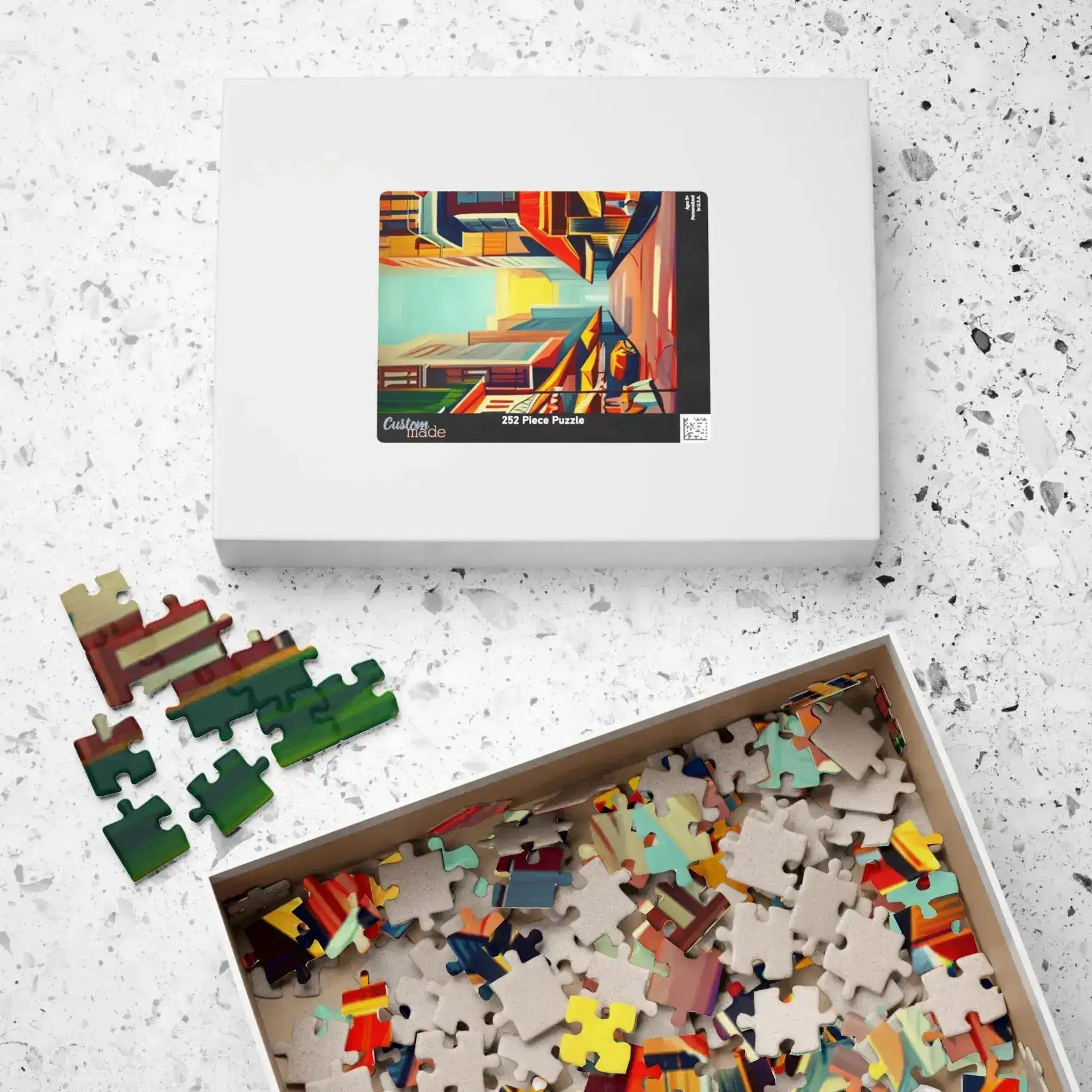 Urban Vibes 252-piece box with open tray of colorful and uncolored jigsaw pieces