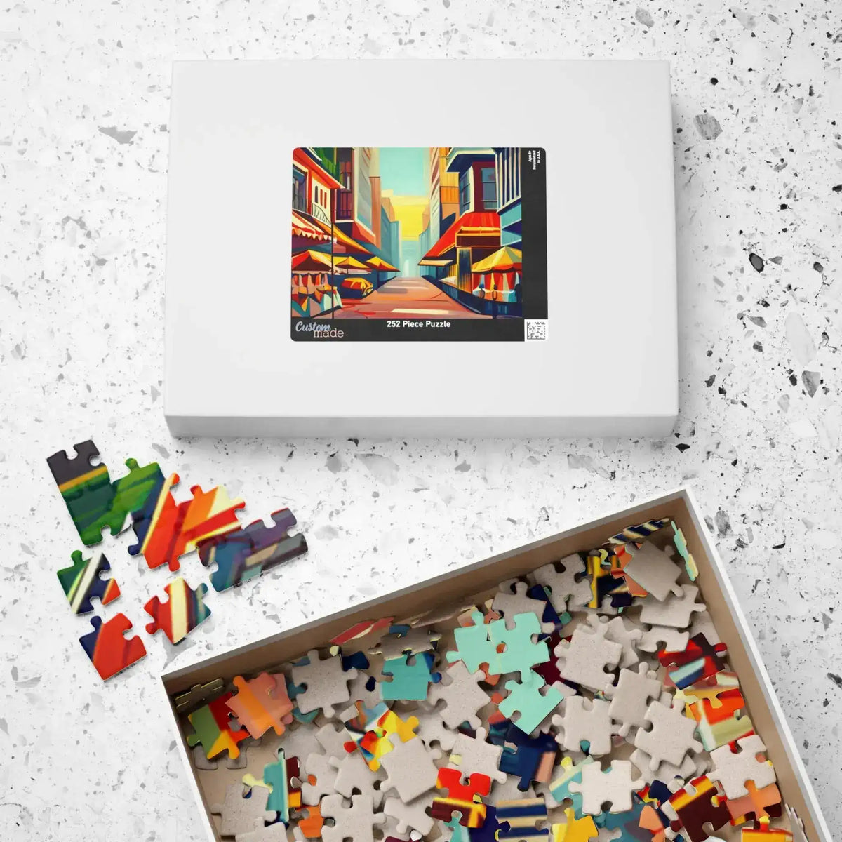 Urban Vibes 252-piece puzzle box beside open tray of mixed colorful and blank pieces