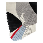 Color swatch of tufted wool rugs on a patio with chairs and plants