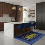 Modern kitchen with marble island, blue chairs, and a patterned rug.