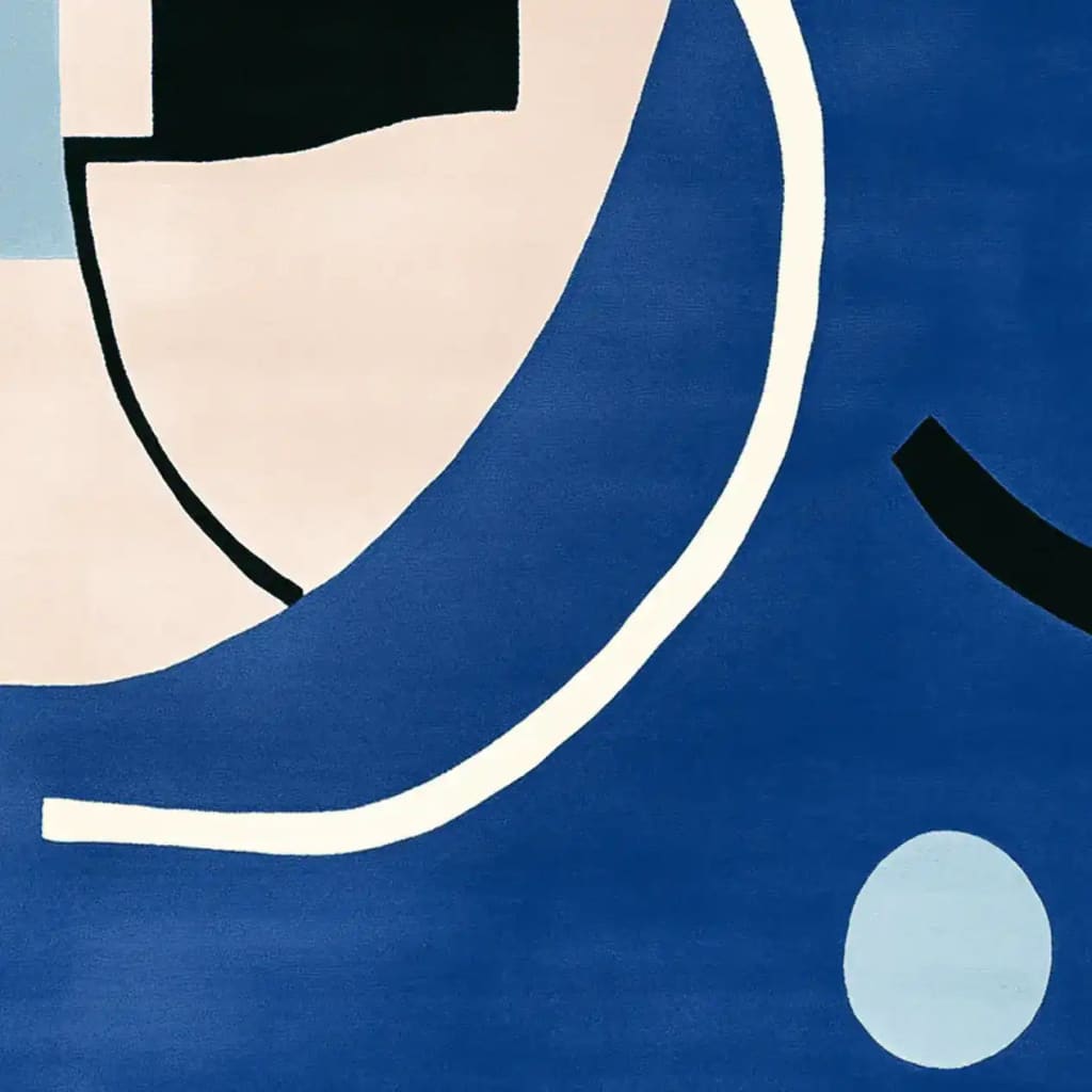 This image showcases a contemporary hand-tufted area rug with a vibrant abstract design, perfect for adding a modern touch to any living room. The wool rug features bold blue tones with contrasting black and white geometric shapes, making it a standout piece among living room area rugs.