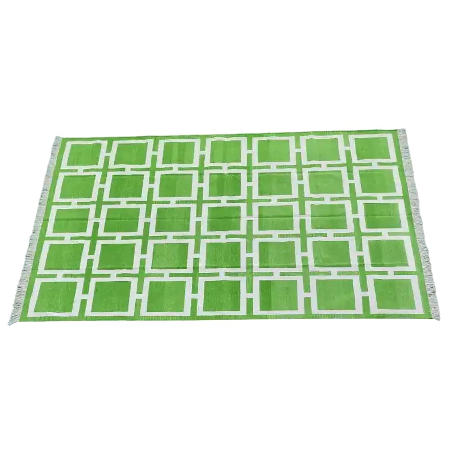 Vibrant green Medina Square area rug, perfect for adding a boho touch to your living room or office. This large cotton rug features a geometric pattern, ideal as a stylish and functional large area rug.