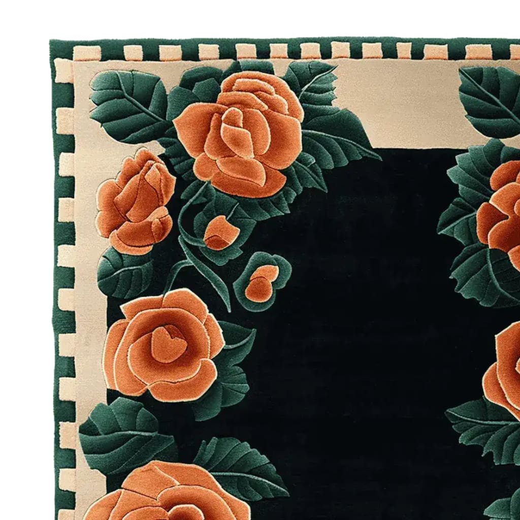 Close-up view of a Velvet Rose Frame Hand Tufted Area Rug, showcasing its intricate floral design with lush orange roses on a dark background. Perfect for adding elegance to living room spaces, this wool rug offers a blend of luxury and comfort, making it an ideal choice for those seeking stylish rugs for living room decor.