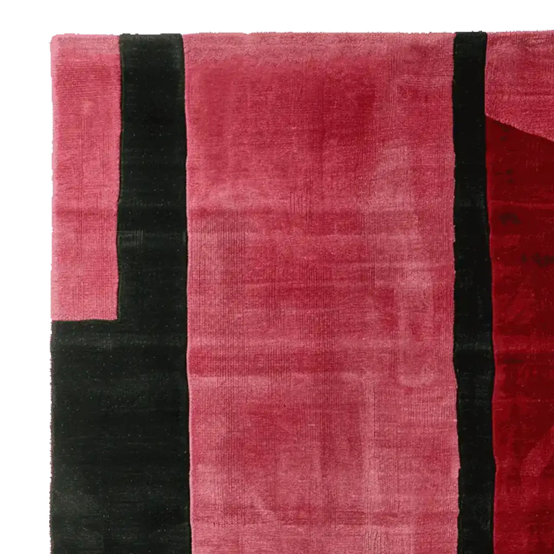 Top view of a Velvet Stripe Tension Hand Tufted Area Rug, featuring a bold contemporary design with rich red and black stripes. Perfect for adding a touch of modern elegance to your living room, this wool rug offers both style and comfort, making it an ideal choice for area rugs in a living room setting.
