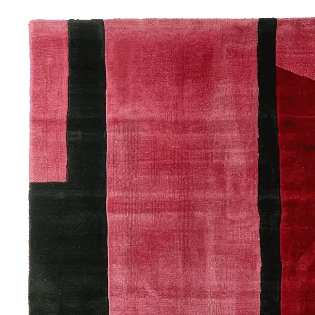 Top view of a Velvet Stripe Tension Hand Tufted Area Rug, featuring a bold contemporary design with rich red and black stripes. Perfect for adding a touch of modern elegance to your living room, this wool rug offers both style and comfort, making it an ideal choice for area rugs in a living room setting.