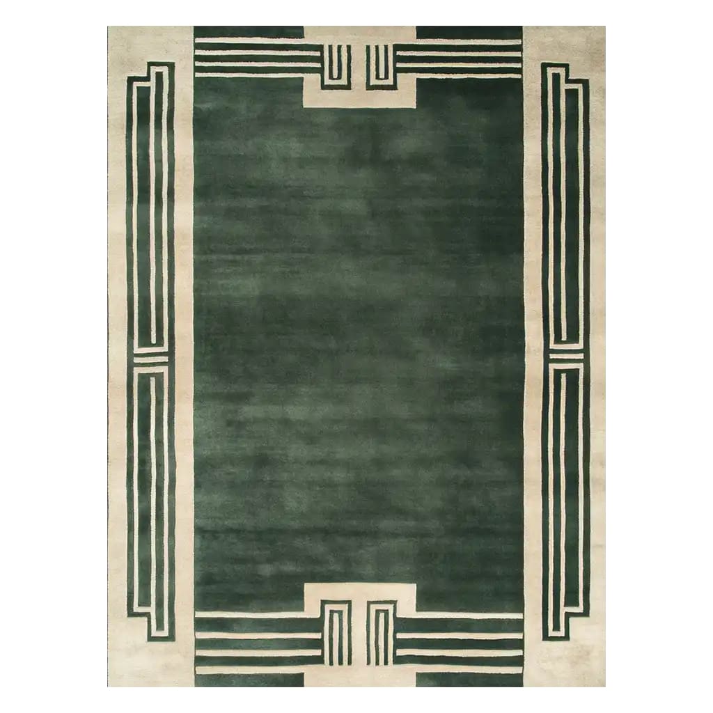 The Verdant Citade Hand Tufted Wool Rug is a stunning area rug perfect for large living room spaces. This contemporary rug features a rich green color with elegant border patterns, showcasing its exquisite craftsmanship. Made from high-quality wool, this rug adds a touch of sophistication and warmth to any home decor.
