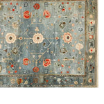 Top view of the Verdant Dreamscape Knotted Wool Rug featuring an intricate floral design in vibrant colors. This area rug is perfect for adding elegance to living room spaces, showcasing its quality as a wool rug.