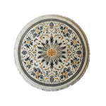 Top view of the Verdant Harmony Knotted Wool Rug, a beautifully designed round area rug featuring intricate floral patterns in shades of gold and black, ideal for large living room spaces.