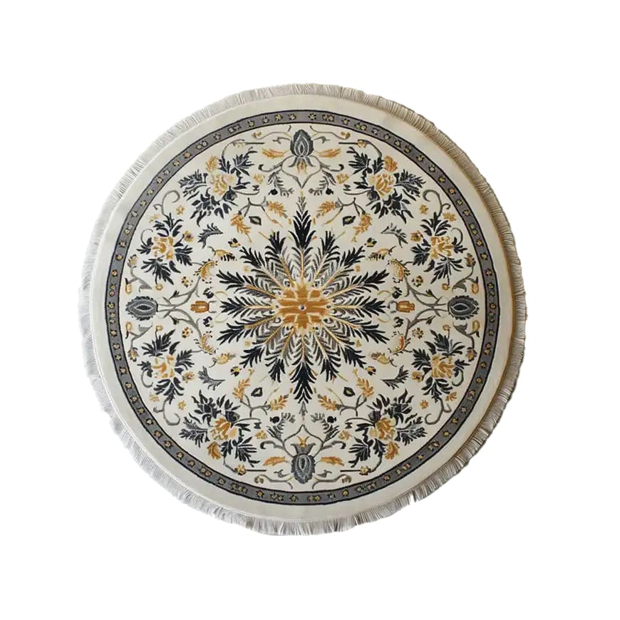 Top view of the Verdant Harmony Knotted Wool Rug, a beautifully designed round area rug featuring intricate floral patterns in shades of gold and black, ideal for large living room spaces.