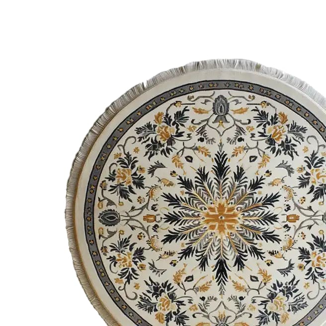 Elegant round area rug crafted from knotted wool, featuring a detailed floral pattern in shades of gold and black, ideal for large living rooms.