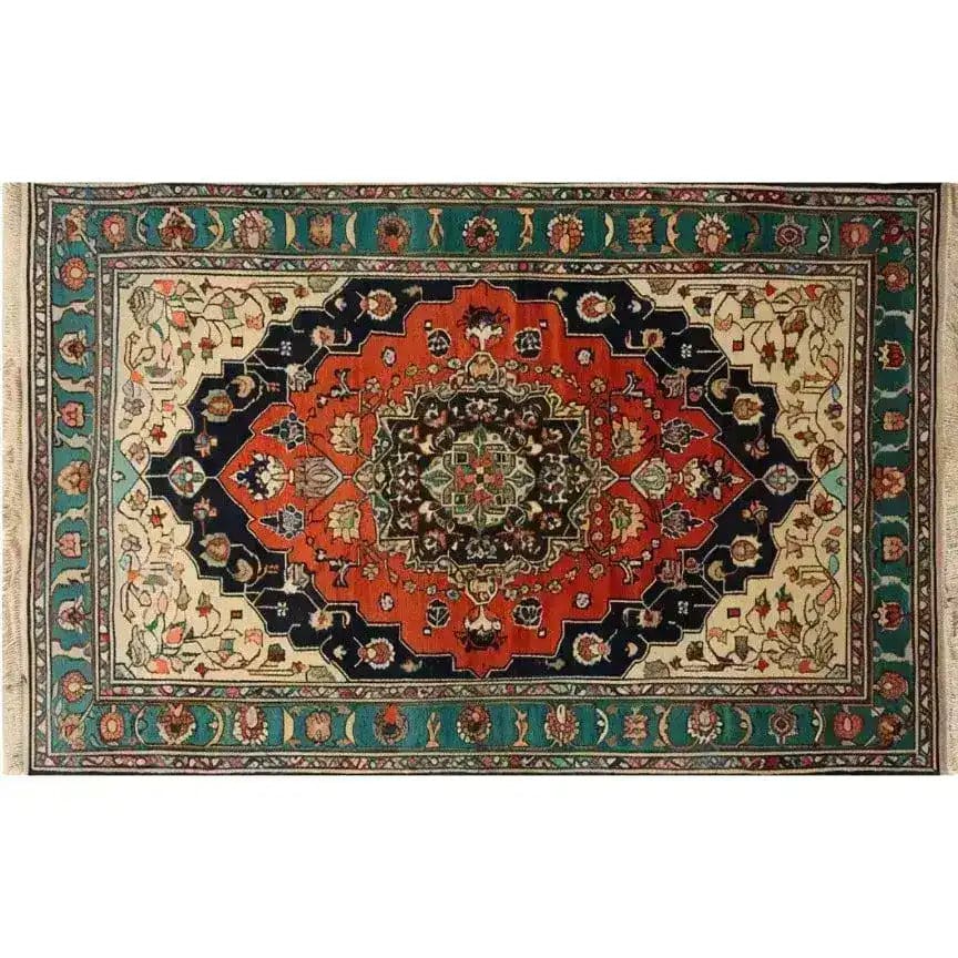 This image showcases the Verdant Haven Hand Knotted Area Rug, a striking Persian-style wool rug perfect for adding elegance to your living room. With its intricate floral patterns and vintage charm, this 8x10 rug features rich, vibrant colors including deep red, navy blue, and cream, making it an ideal centerpiece for any home decor.