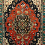 A vibrant Verdant Haven Hand Knotted Area Rug featuring intricate floral patterns and rich colors. This Persian-style wool rug is perfect for living rooms, measuring 8x10, and offers a vintage charm. The detailed design includes a striking arrangement of floral motifs that adds elegance and warmth to any space.
