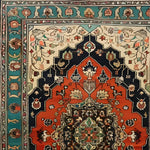 Detailed view of the Verdant Haven Hand Knotted Area Rug showcasing its intricate Persian floral design. The rug features a vibrant mix of colors with rich red, deep blue, and lush green hues, typical of vintage rugs. Ideal as an 8x10 wool rug for living rooms, it brings a classic touch to any space.