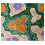 Top view of the Verdant Kaleidoscope Hand Tufted Wool Rug featuring vibrant abstract floral patterns in shades of green, orange, purple, and beige. This area rug adds a splash of color and style to living room spaces, making it an ideal choice for those seeking unique wool rugs for the living room.