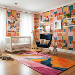 Colorful nursery with geometric wall patterns, a crib, and decorative rug.