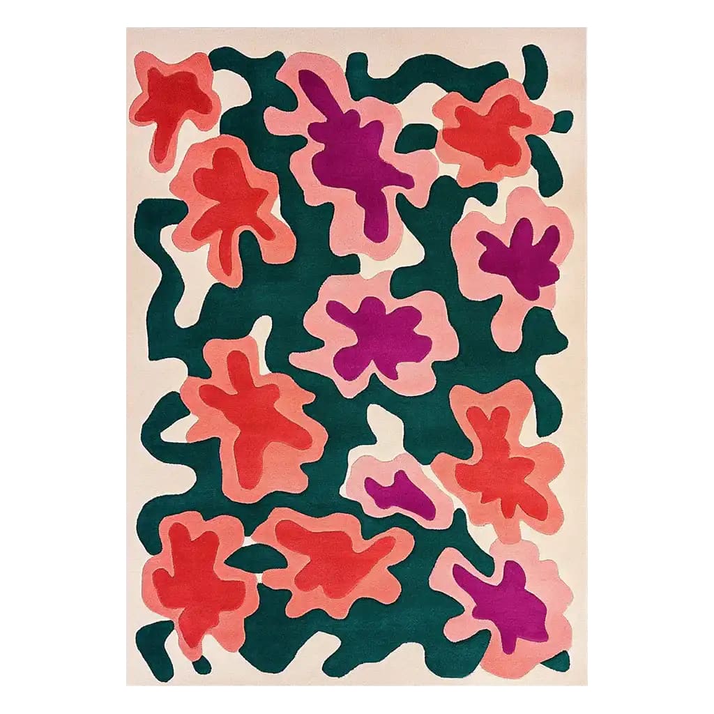 A vibrant area rug featuring an abstract floral design with bold red, pink, and purple shapes against a deep green background. This contemporary wool rug is perfect for large living rooms, adding a splash of color and modern style.