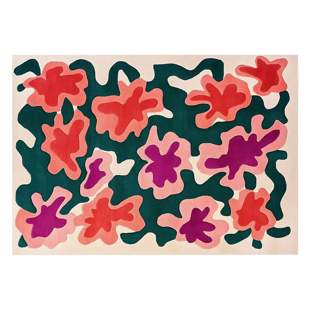 This vibrant area rug features an abstract floral design with bold red, pink, and purple shapes against a dark green background. Perfect for large living rooms, this contemporary wool rug adds a touch of artistic flair and warmth to any space.