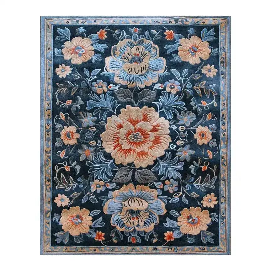 Verdant Tapestry Hand Tufted Rug featuring an elegant floral design, perfect as a dining room area rug. This vintage-inspired wool rug showcases a beautiful array of flowers on a dark background, creating a stunning and inviting atmosphere.