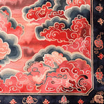 Vermilion Cloud Frame Hand Tufted Area Rug featuring an intricate abstract design in vibrant reds, blues, and greys. This wool rug, perfect for large living rooms, adds a touch of elegance with its detailed border and cloud motif, making it an ideal choice for area rugs in the living room.