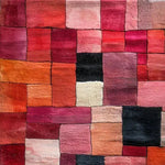 A vibrant Vermilion Grid Hand Tufted Area Rug featuring a striking patchwork of red, pink, and orange hues. This contemporary wool rug is perfect for adding a pop of color to your living room. Ideal for those looking for large area rugs to enhance their space with a modern touch.