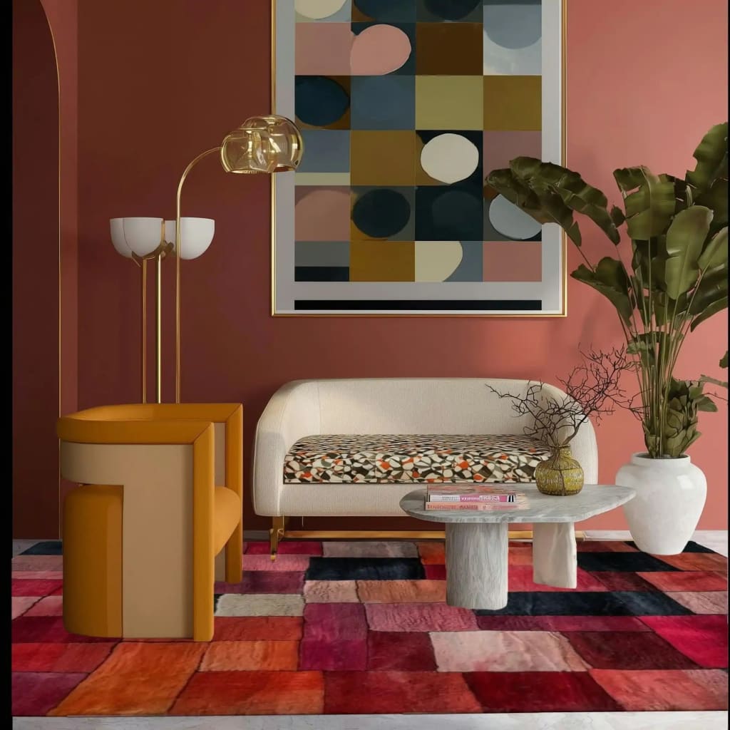 A stylish living room featuring a Vermilion Grid Hand Tufted Area Rug. The contemporary wool rug, with its vibrant red, orange, and pink geometric pattern, covers the floor, complementing the modern decor. A sleek sofa and elegant table sit atop the large area rug, perfect for enhancing any living room space.