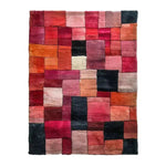 Vermilion Grid Hand Tufted Area Rug showcasing a vibrant patchwork of red, orange, and pink tones. This wool rug is perfect for adding a contemporary touch to your living room, ideal for those seeking large area rugs for a stylish and cozy atmosphere.