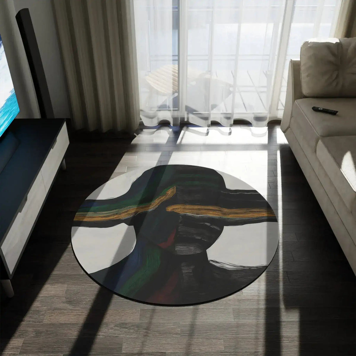 Vibe Split Round Rug with abstract black and gold pattern on dark wood floor in modern room with TV unit and sofa