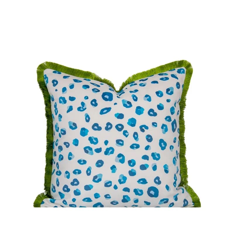 Vibrant aquatic leopard throw pillow cover featuring a colorful blue leopard print design against a white background with a green fringe edge.