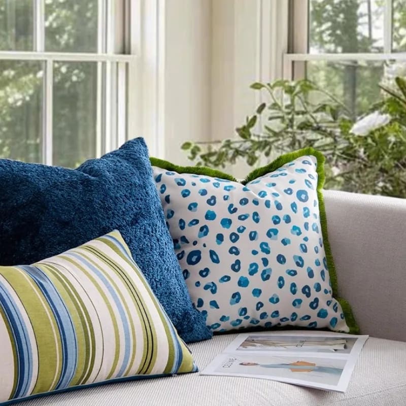 Vibrant aquatic leopard throw pillow cover featuring a playful blue and white leopard print, perfect for adding a pop of color to any living space.