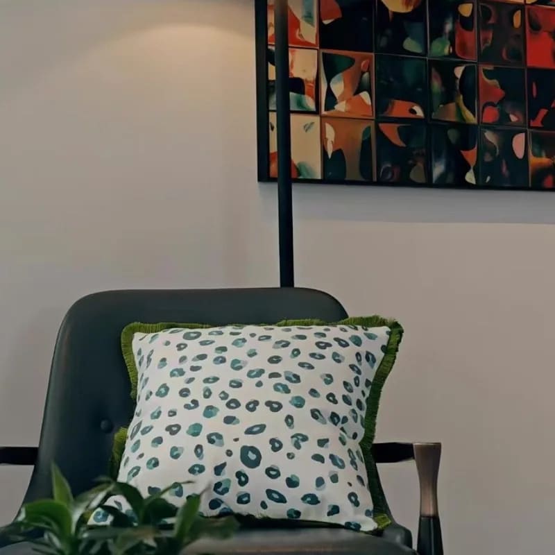 Vibrant aquatic leopard throw pillow cover featuring a playful pattern on a white background, perfect for adding a pop of color to any living space.