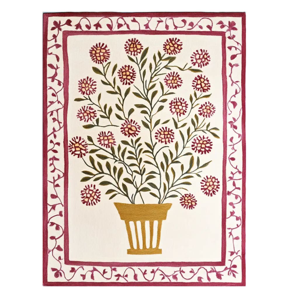 Top view of a Vibrant Bloom Cascade Hand Tufted Wool Rug, featuring a detailed floral pattern with a central potted plant design. This area rug, ideal for large living rooms, showcases a contemporary style in shades of green and pink, perfect as a wool rug for an 8x10 living room setting.