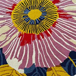 Close-up of the Vibrant Bloom Tapestry hand tufted round area rug, showcasing a detailed floral pattern in pink, yellow, and blue, ideal for brightening up dining rooms or offices. This wool rug offers a touch of elegance and charm, perfect for those looking to add a pop of color with a floral rug design.