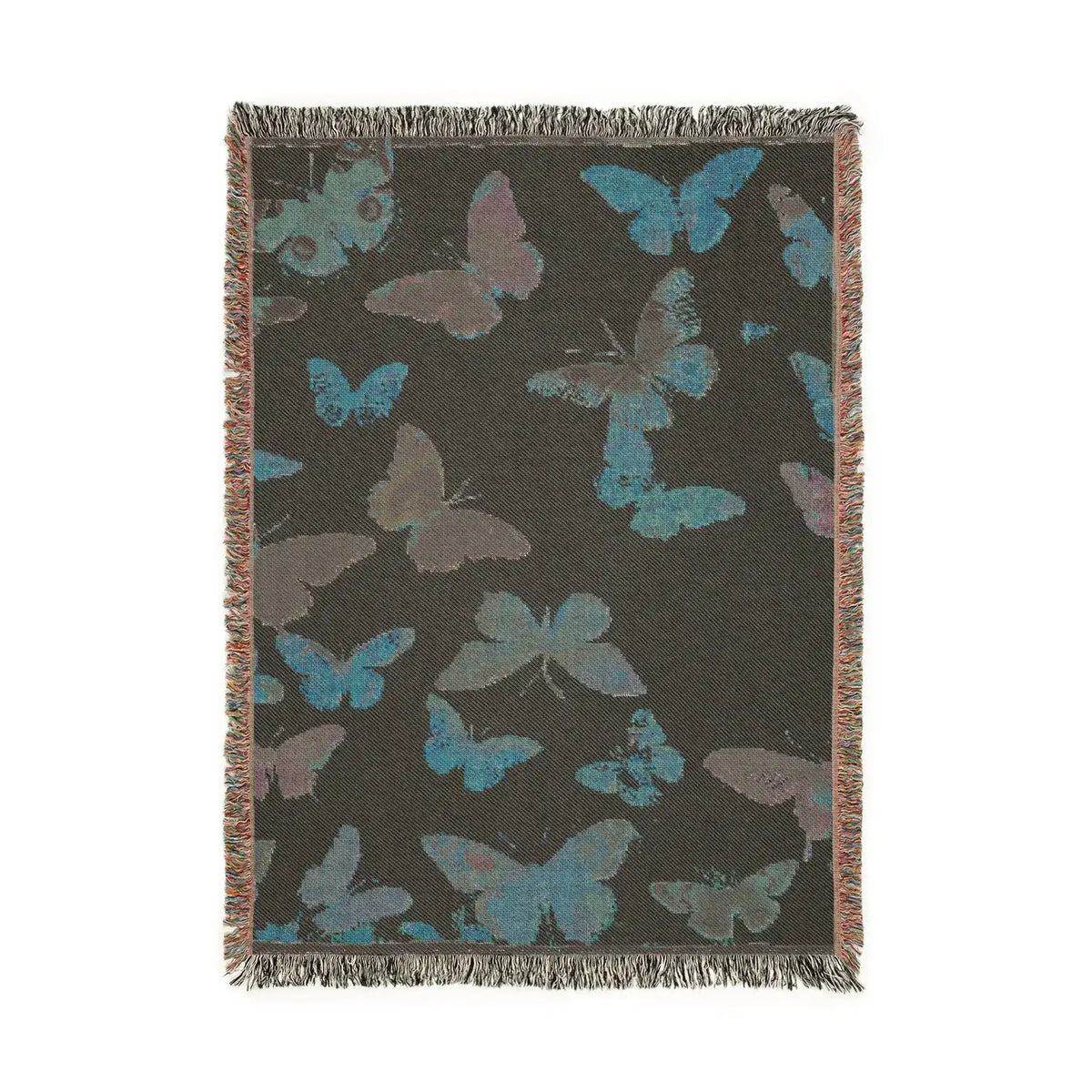 Vibrant Butterfly Woven Blanket charcoal-dark reverse side showing teal and gray-purple butterfly silhouettes woven on dark ground with fringed edges