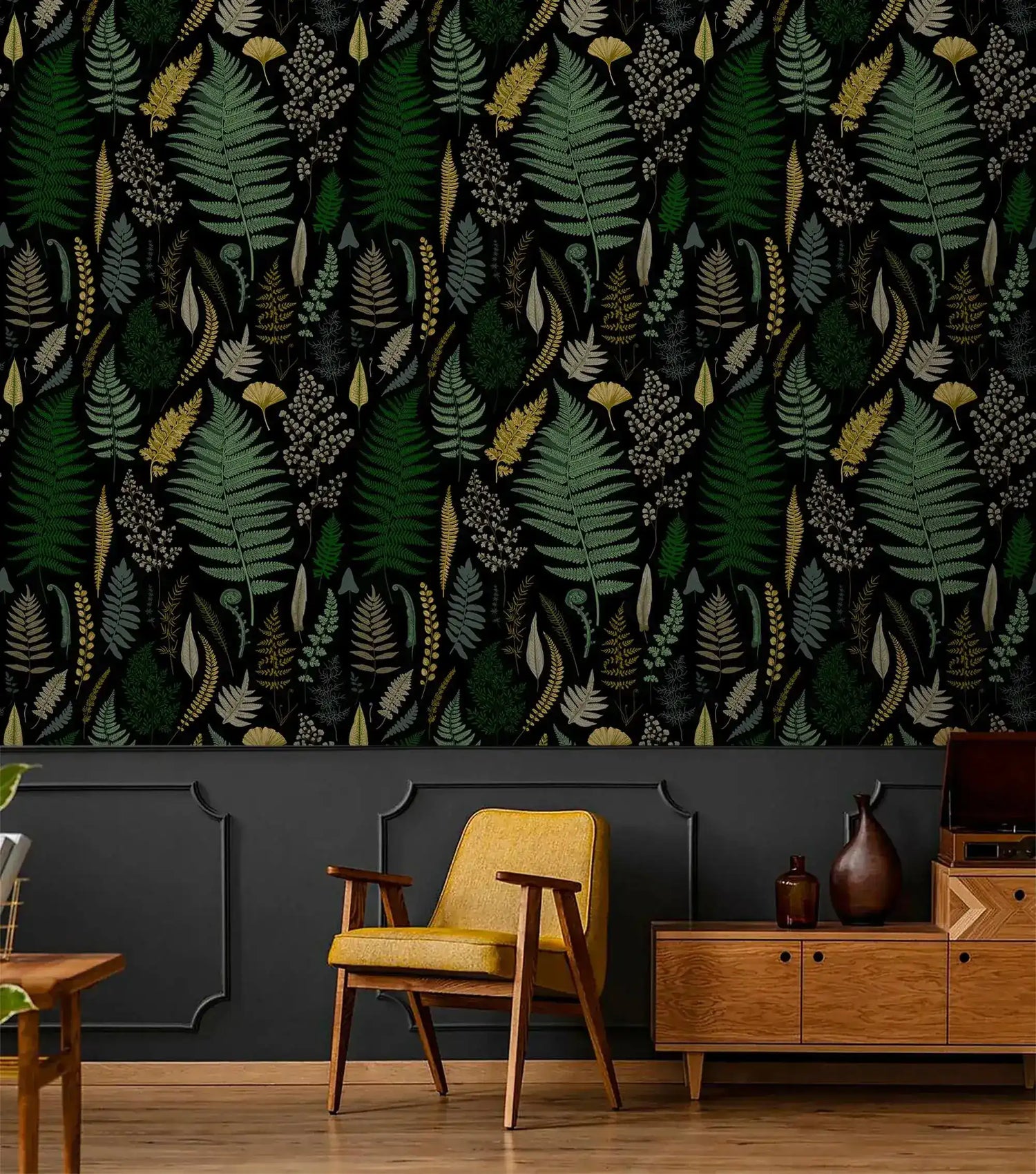 Vibrant fern canopy wallpaper over dark wainscot with yellow midcentury chair and walnut sideboard