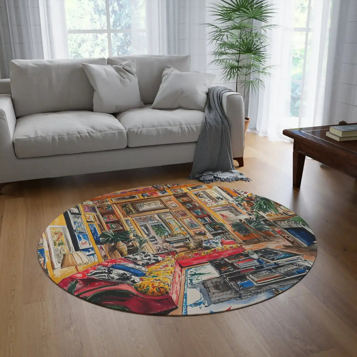 Vibrant Floral Deco Round Rug in bright living room with grey sofa and palm plant, eclectic gallery wall interior design visible from above