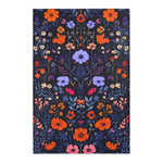 Dense wildflower embroidered pattern on deep navy ground with orange marigolds, purple cosmos, pink and white blooms, Vibrant Floral Embroidered Accent Rug flat view
