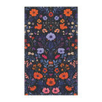 Dark navy Vibrant Floral Embroidered Cotton Kitchen Towel flat portrait with dense orange, lavender and pink wildflower botanical pattern
