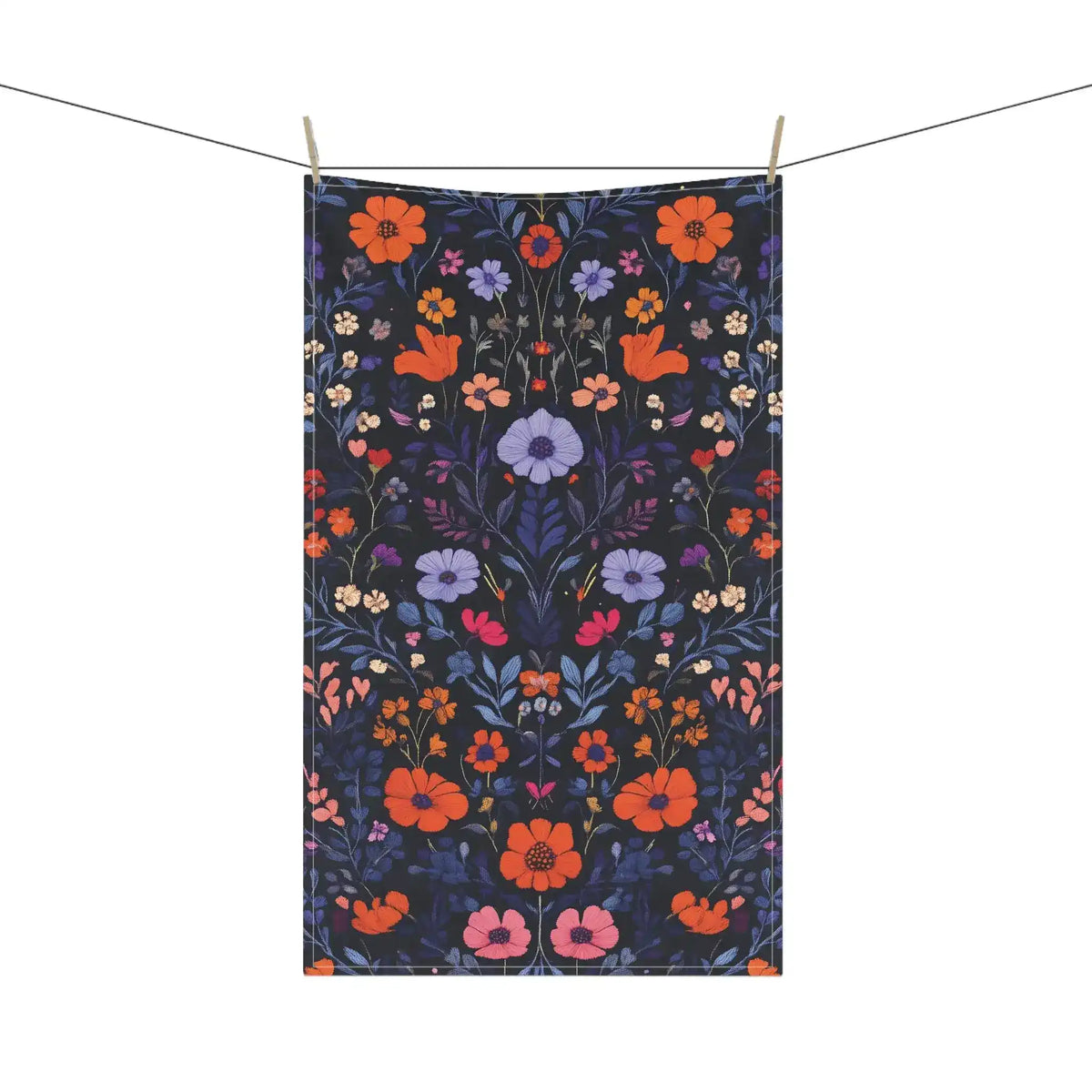 Vibrant Floral Embroidered Cotton Kitchen Towel on clothesline with full-length orange, lavender and pink botanical floral on dark navy