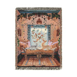 Full woven tapestry view of cats resting on a gilded chaise in a peach floral-wallpapered room with fringe edge on the Vibrant Floral and Feline Woven Blanket