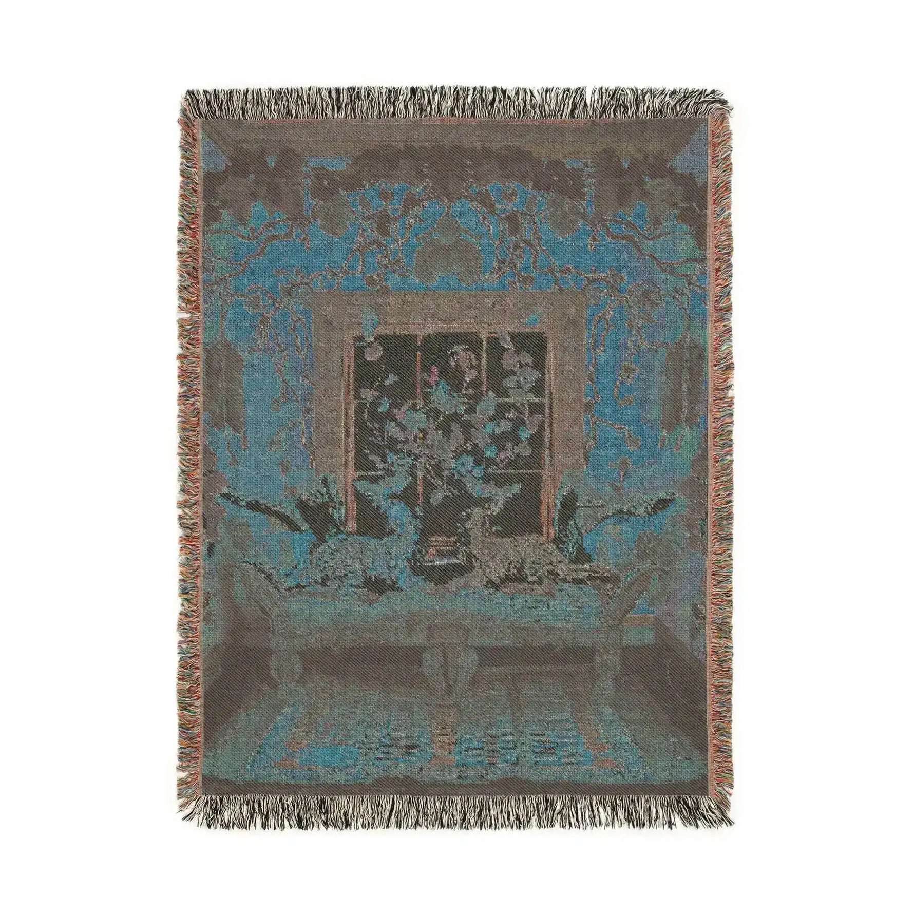 Portrait-format dark teal-grey woven version of cats lounging on chaise in a floral room with knotted fringe on the Vibrant Floral and Feline Woven Blanket