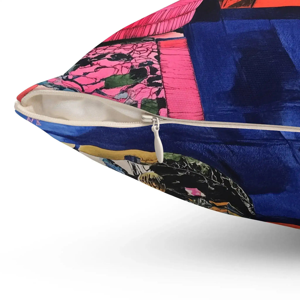 Close-up corner of Vibrant Floral Luxe Pillow white zipper closure pink and blue printed fabric detail