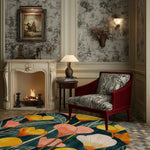 A cozy living room featuring a vibrant meadow hand tufted round area rug with a floral design. This wool rug adds a splash of color to the elegant setting, complementing the classic armchair and fireplace. Perfect for both dining room and living room spaces, this round rug enhances the overall warmth and style.