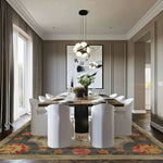 Modern dining room with a wooden table and white chairs on a patterned floral persian rug.