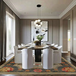 Modern dining room with a wooden table and white chairs on a patterned floral persian rug.