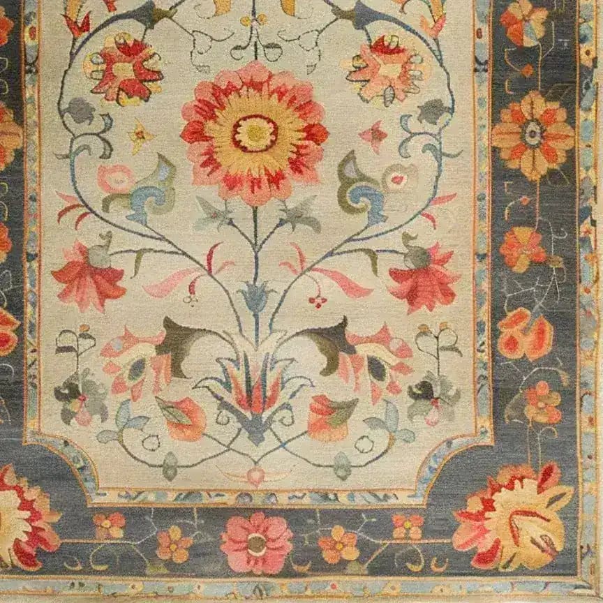 A vibrant and intricately designed hand-knotted area rug featuring a stunning floral pattern, reminiscent of traditional Persian rugs. This large living room rug, ideal for an 8x10 space, showcases a rich tapestry of colors with a dominant central flower and a detailed border, perfect for adding elegance and modernity to any home.