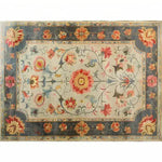 This vibrant modernity hand knotted area rug showcases a stunning Persian-inspired design with intricate floral patterns. The rug, perfect for large living rooms, features a harmonious blend of rich colors and detailed motifs, making it an ideal choice for those seeking elegant living room rugs in an 8x10 size.