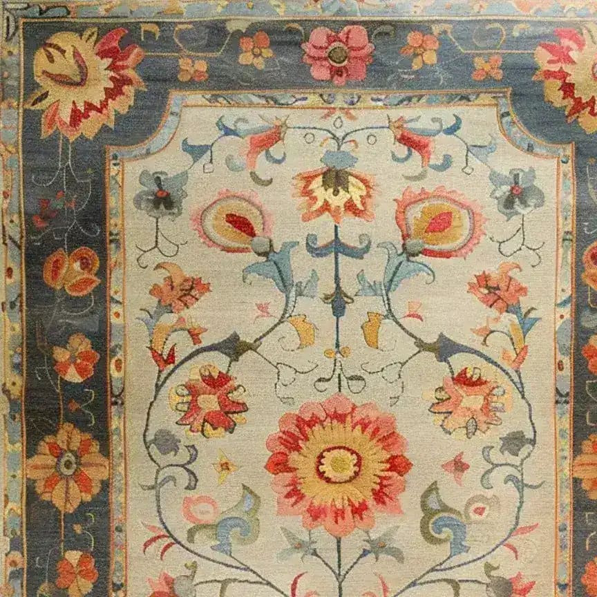 Close-up view of the Vibrant Modernity Hand Knotted Area Rug, showcasing intricate floral patterns inspired by traditional Persian rugs. This large living room rug, sized 8x10, features a harmonious blend of vivid colors set against a neutral background, perfect for enhancing any modern decor.